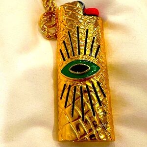 Gold Eye lighter Pendant Necklace by Thorne Dynasty Bella Thorne